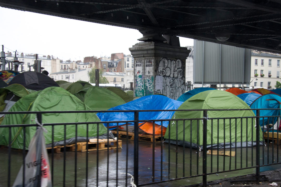 Migrants Living In Makeshift Camp Near Metro La Chapelle In Paris
